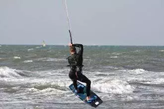 Man doing kite surfing i the sea